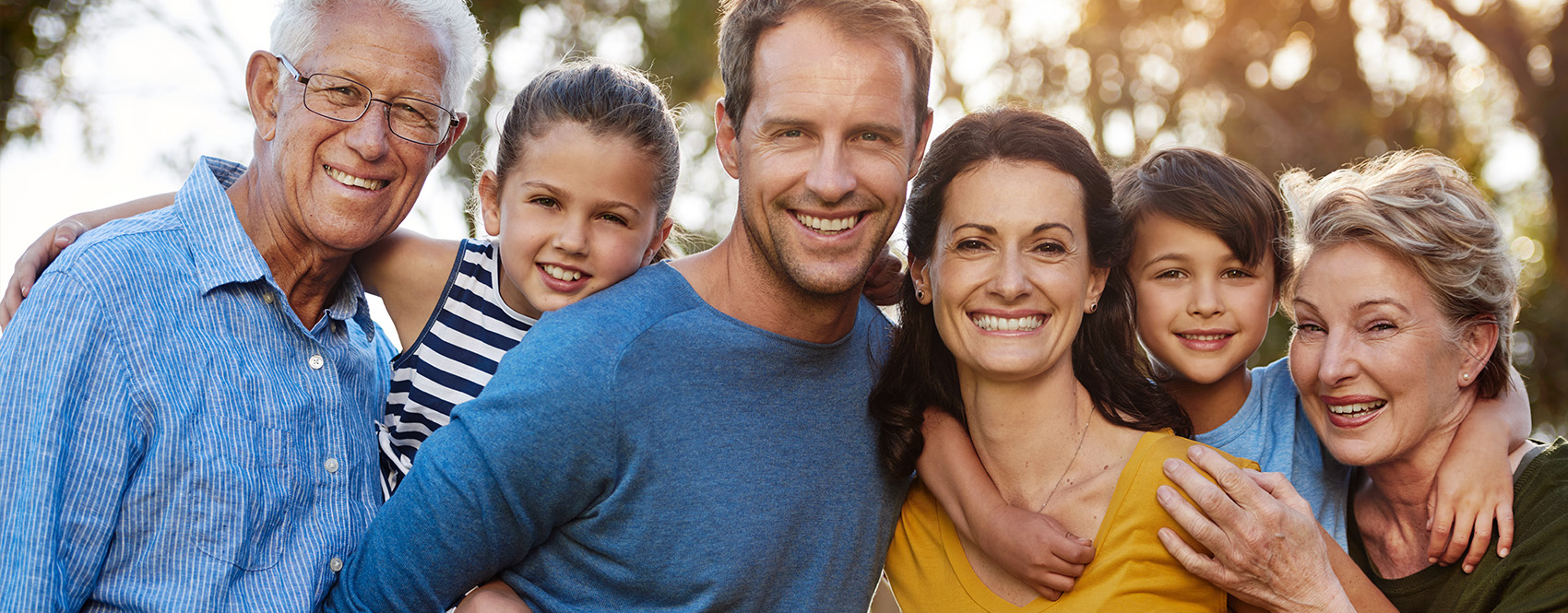 Parents, grandparents, and children posing together for a photo